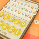 Tablica manipulacyjna sensoryczna montessori walizka dinozaury Kik Sp. z o. o. Sp. k.